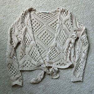 Vestique knit sweater with tie